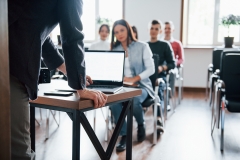 using-laptop-group-people-business-conference-modern-classroom-daytime